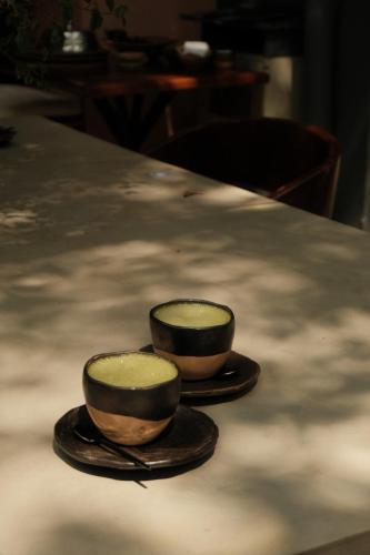 two bowls sitting on top of a table at Sui Boutique Hotel in Medellín