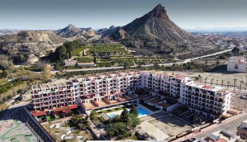 an aerial view of a building with a mountain in the background at NATUR Spa in Villanueva de Río Segura