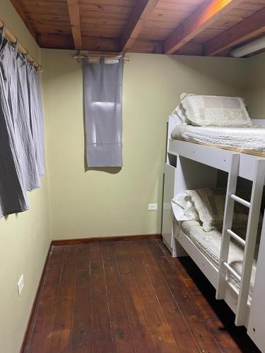 เตียงในห้องที่ Duplex Rio Uruguay 161