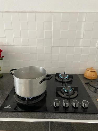 a pot on top of a stove in a kitchen at Malka Casas - Hoteles in Marco