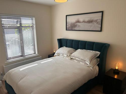 Voodi või voodid majutusasutuse Cosy Apartment in the Centre of Tramore Town toas