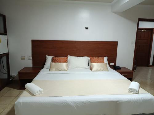 Postel nebo postele na pokoji v ubytování Hostal Bicentenario