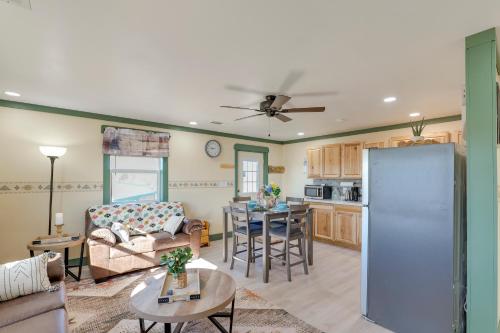 a living room with a couch and a kitchen at 9 Mi to Lake Carlsbad Pet-Friendly Apt in Carlsbad
