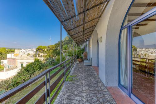 a balcony of a house with a view of a city at Villa Blu La Cambusa in Castro di Lecce