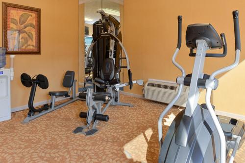 a gym with treadmills and exercise bikes in a room at Quality Inn & Suites Fayetteville I-95 in Fayetteville