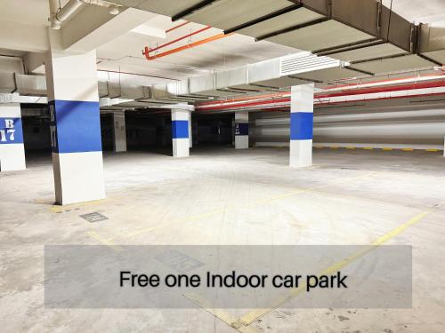 an empty parking lot with a fire one indoor car park at ICC Ipoh Town Premium Suites By IWH Suites in Ipoh