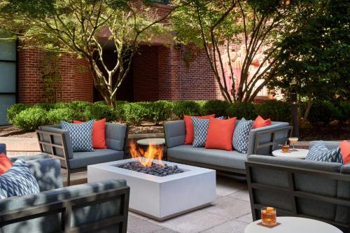 a patio with couches and a fire pit at Four Seasons Washington DC in Washington