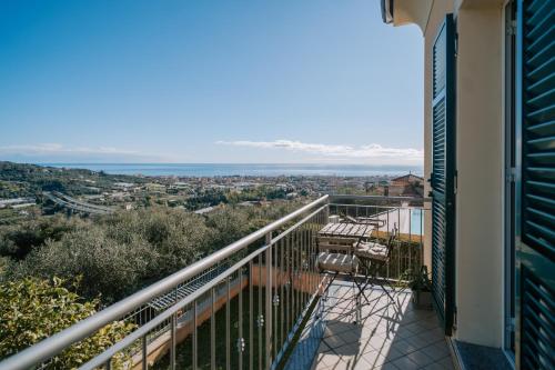 a balcony with a view of the ocean at Casa Bella Vista in Diano Castello