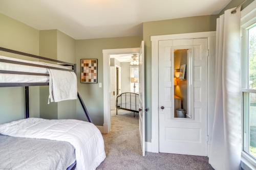 a bedroom with a bed and a window and a door at 15 Mi to Dtwn Lexington Serene Wilmore Home! in Wilmore