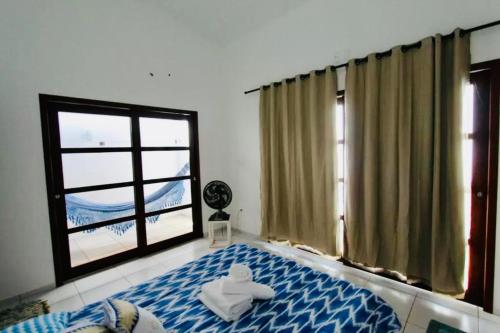 En eller flere senge i et værelse på Casa Aroma do Mar