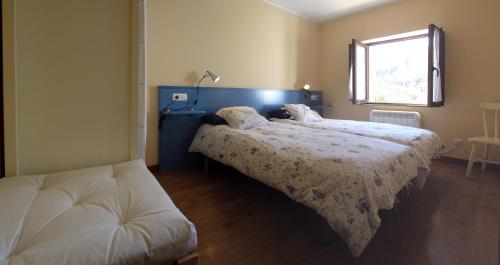 Cama o camas de una habitación en Apartamentos Rurales la Estación