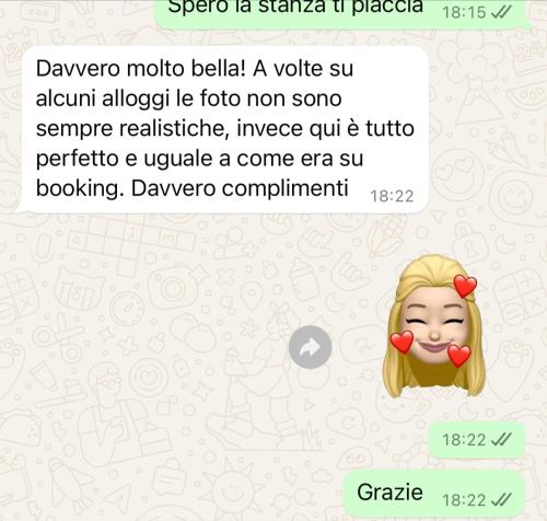 a screenshot of a text message of a girl with a clown at Xcross Suites Garbatella in Garbatella