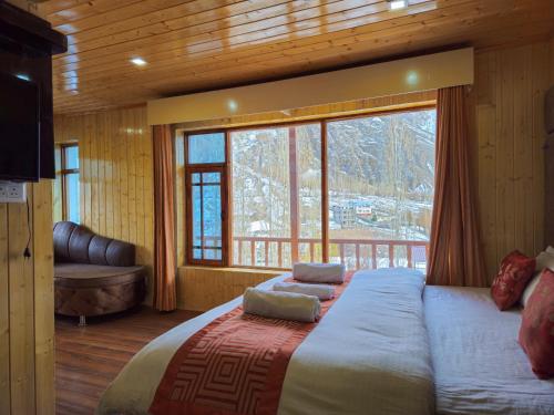 Postel nebo postele na pokoji v ubytování The VILLAGE RESORT ASHUNA