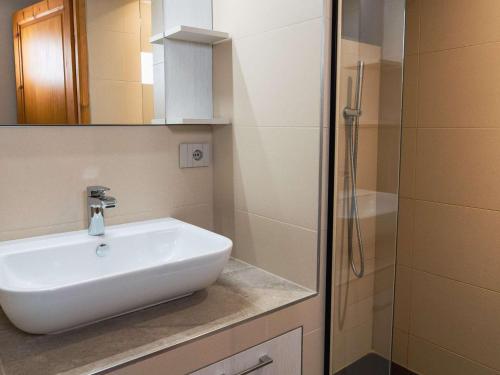 a bathroom with a sink and a shower at Chalet triplex à Val Thorens - 10 pers, cheminée, à 50m des pistes - FR-1-637-83 in Val Thorens