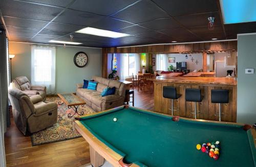 a living room with a pool table in it at Black Jacks Downtown Loft in West Jefferson