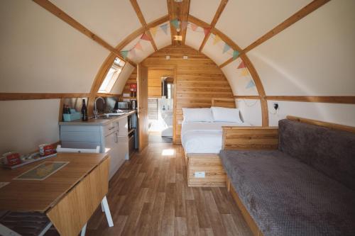 a room with a bed and a couch in a room at Sedgewell Barn by Wigwam Holidays in Northallerton