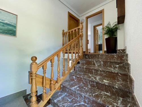 a staircase in a home with a stone stair case at Matxiku Aurre in Berástegui