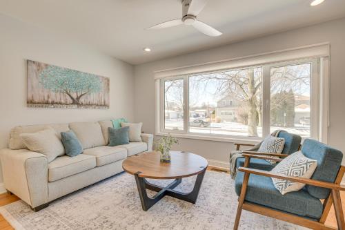 a living room with a couch and a table at 2 Mi to Northwestern Updated Home with Game Room! in Evanston