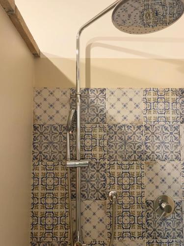 a shower in a bathroom with a shower curtain at Todi Villa San Martino in Todi