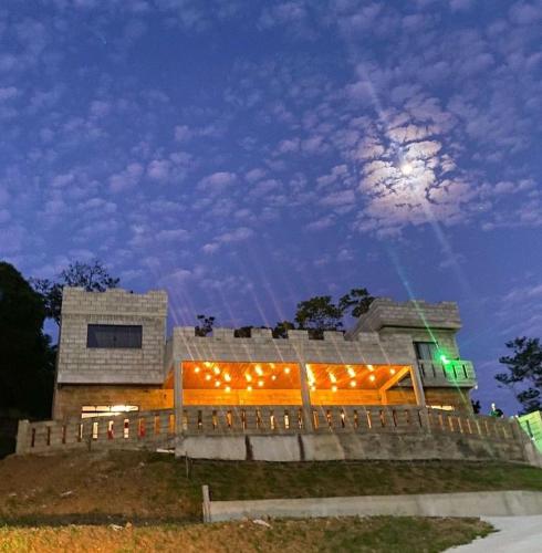 a building with lights on it at night at Pousada Castelo in São Carlos