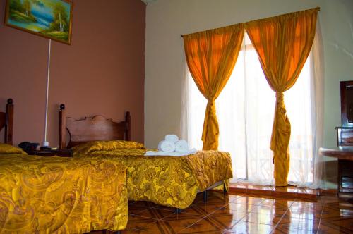Postel nebo postele na pokoji v ubytování Hotel Antigua Comayagua