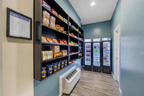 a grocery store aisle with shelves of food at Sleep Inn & Suites Huntsville near US Space & Rocket Center in Huntsville