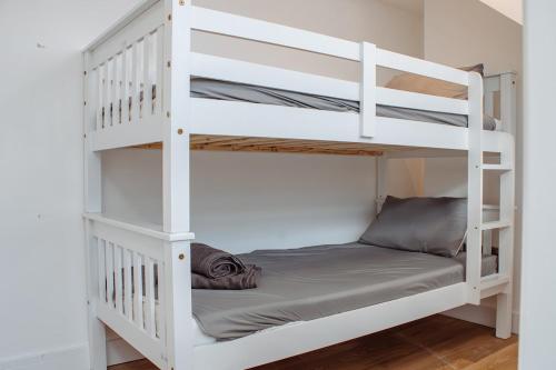 a white bunk bed in a room at Spacious 13-Bed in the Heart of Headingley in Headingley