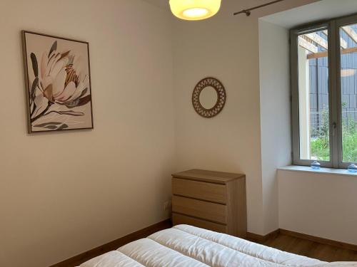 a bedroom with a bed and a window at Appartement Neuf avec Terrasse au Coeur de Le Palais - FR-1-418-258 in Le Palais