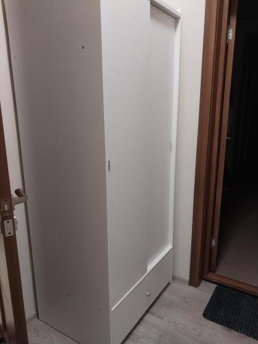 a white closet door in a room at Hotel Avatar in Oleksandriya