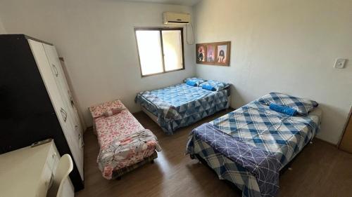 Postel nebo postele na pokoji v ubytování Casa com piscina em São Gabriel RS