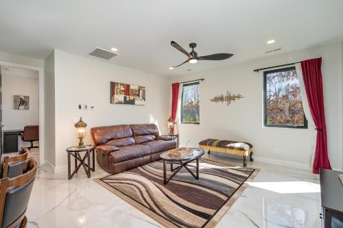 a living room with a leather couch and a table at Phillips Apt in Matthews
