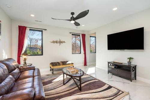 a living room with a couch and a flat screen tv at Phillips Apt in Matthews