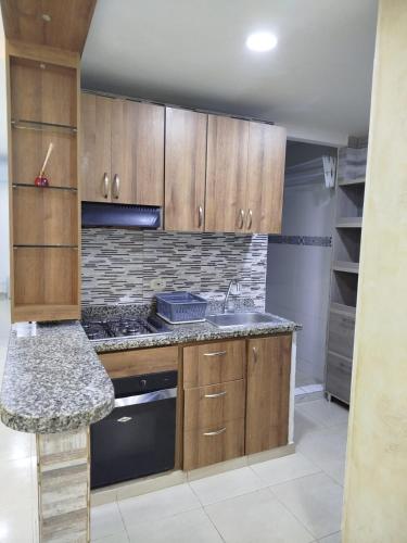 Η κουζίνα ή μικρή κουζίνα στο CAÑAHUATE, Apartamento con aire acondicionado y piscina