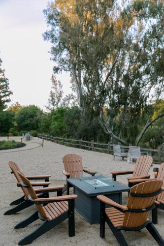 a group of chairs and a table with a blue at River Terrace Inn, a Noble House Hotel in Napa
