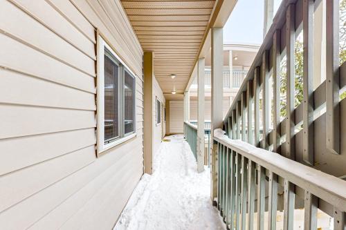 a corridor of a house with snow on the porch at Pinnacle Inn in Beech Mountain