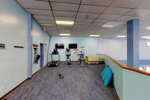 a hospital room with a gym with exercise equipment at Pinnacle Inn in Beech Mountain