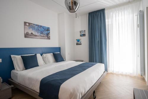 Postel nebo postele na pokoji v ubytování Hezio Guest House