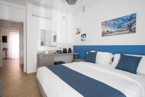 Postel nebo postele na pokoji v ubytování Hezio Guest House