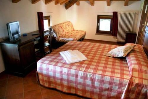 Säng eller sängar i ett rum på Affittacamere Il Contadino