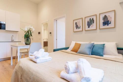 Postel nebo postele na pokoji v ubytování Lagrange Apartments