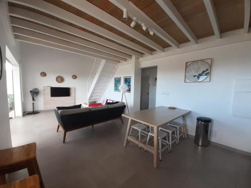 TV a/nebo společenská místnost v ubytování Appartement neuf a 150 metres de la mer wifi