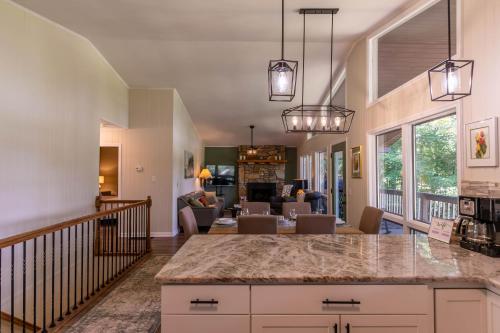 a kitchen and living room with a large counter top at Fairway Gem at Spruce Pine in Spruce Pine