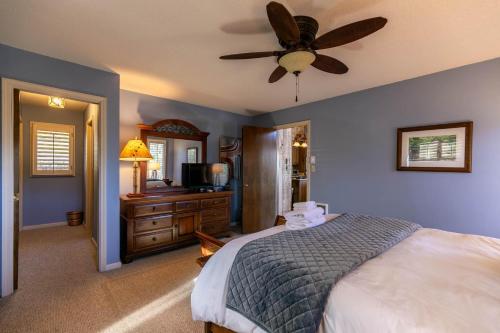 a bedroom with a bed and a ceiling fan at Hawk Haven in Banner Elk