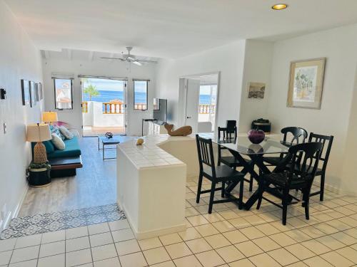 a dining room and living room with a table and chairs at Bright Avalon Villa W Ocean Views & Hot Tub in Avalon
