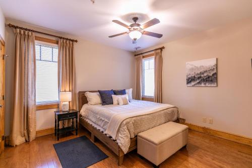 a bedroom with a bed and a ceiling fan at Endless Grandfather View at Echota in Valle Crucis