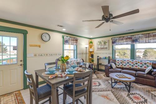 a living room with a table and a couch at Near ATV Trails Carlsbad Apt with Shared Fire Pit in Carlsbad