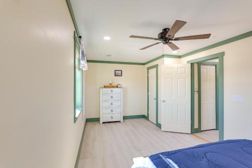 a bedroom with a ceiling fan and a dresser at Near ATV Trails Carlsbad Apt with Shared Fire Pit in Carlsbad
