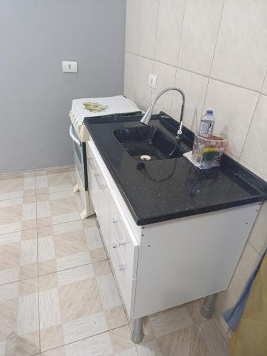 a kitchen with a sink and a counter top at Studio _ Santana de Parnaíba SP in Santana de Parnaíba