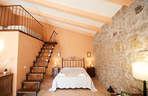 A bed or beds in a room at Tenuta Saracone