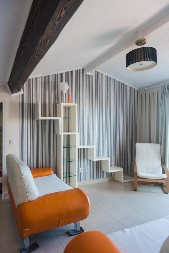 a bedroom with a bed and a book shelf at Flor do Mar House in Ponta Delgada